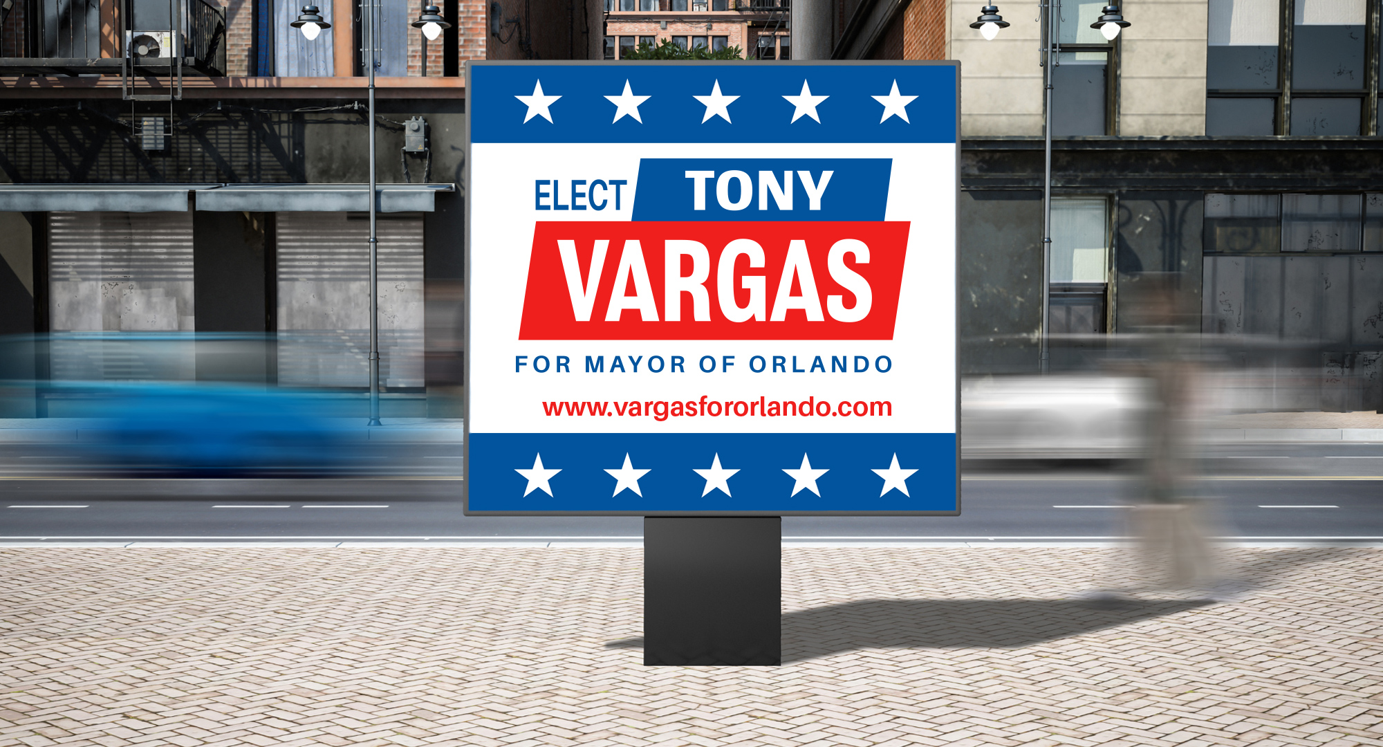 Outdoor street-side campaign billboard graphic promoting a mayoral candidate in a downtown urban area.